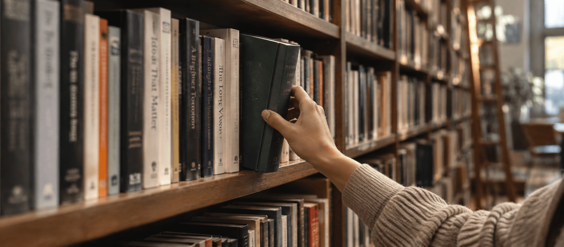 Picking a book in a bookshelf